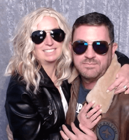 John and Clarissa Vogel in a Classic Photo Booth pose as Top Gun's Maverick and Charlie